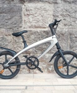 white cruzaa ebike outdoors leaning